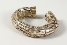 AN ISLAMIC SILVER METAL BANGLE.