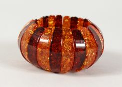A TWO-COLOUR AMBER BRACELET.