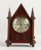 A 19TH CENTURY MAHOGANY MANTLE CLOCK, with eight day movement, the circular silvered dial signed