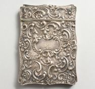 A VICTORIAN SILVER CALLING CARD CASE by JOSEPH WILLMORE, decorated with scrolls and flowers,