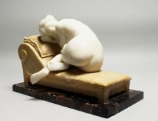 A GOOD LATE 19TH CENTURY CARVED WHITE MARBLE RECLINING FEMALE NUDE, mounted on a yellow marble day