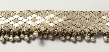 AN ISLAMIC SILVER METAL NECKLACE.