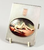 AN ENGINE TURNED SILVER CIGARETTE CASE with oval nude. Birmingham 1938.