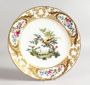 A SEVRES PLATE decorated with birds in a landscape, probably in Madeley by Thomas Martin Randall.
