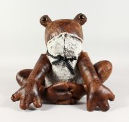 A LEATHER FROG DOORSTOP.