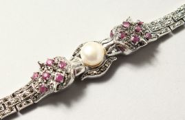 A SILVER, RUBY AND MALACHITE PANTHER BRACELET.