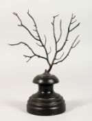 A BLACK TREE CORAL SPECIMEN, on an ebonised stand. 7ins high inc. stand.