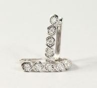 A GOOD PAIR OF 18CT WHITE GOLD DIAMOND SET HALF HOOP EARRINGS.