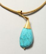 AN ISLAMIC TURQUOISE PENDANT on a chain.