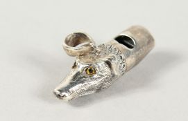 A CAST SILVER DOG WHISTLE.