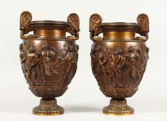 A PAIR OF SUPERB QUALITY 19TH CENTURY BRONZE RENAISSANCE DESIGN TWO-HANDLED URNS, the sides with