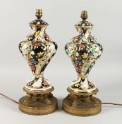 A GOOD PAIR OF ZSOLNAY PIERCED PORCELAIN VASES, on gilt stands converted to lamps. 17ins high.