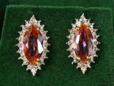 A PAIR OF 9CT GOLD, AZOTIC TOPAZ AND DIAMOND EARRINGS.
