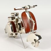 A SMALL LEATHER AND CHROME SCOOTER.