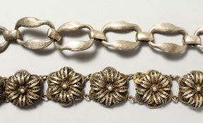 A SILVER FILIGREE BRACELET; and another bracelet.