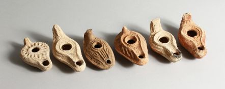 SIX ROMAN POTTERY LAMPS.