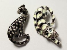 TWO SILVER, MARCASITE AND ENAMEL ART DECO PANTHER BROOCHES.