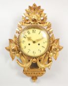 A GILTWOOD CARTEL WALL CLOCK.