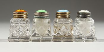 FOUR CUT GLASS, SILVER AND ENAMEL TOP SALTS.