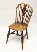 A 19TH CENTURY ASH AND ELM WHEELBACK SIDE CHAIR.