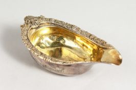 A GEORGE III SILVER PAP BOAT, with a decoratively cast rim, with grape and vine and leopards head