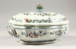 A LATE 19TH CENTURY CONTINENTAL FAIENCE VEGETABLE TUREEN AND COVER, with polychrome decoration.