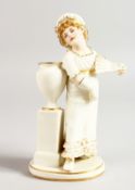 A ROYAL WORCESTER FIGURE OF A GIRL WITH A FAN.