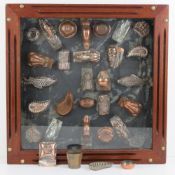 A collection of antique jelly / mousse moulds, approximately 32 (28 mounted in a display),