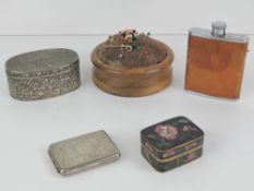 A vintage turned mahogany pin cushion, together with a plated leather covered miniature hip flask,