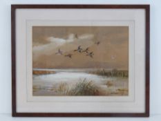 AR Roland Green (1896-1972) watercolour; Ducks in flight over an estuary, signed lower right,