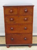 A delightful short set of two over three mahogany drawers all with turned handles, 77cm wide,