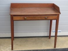 A 19th century mahogany wash stand, single frieze drawer, raised over tapering legs, 94cm wide.