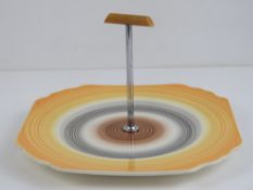 A single art deco square shaped cake plate having banded decoration, 21cm wide.