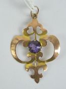 A 9ct gold art nouveau pendant of floral form, having central round cut amethyst, stamped 9ct, 3.
