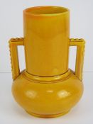 A circa 1890 Ault- like earthenware deep yellow glazed vase with bulbous base,