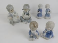Six (four + two) unmarked Lladro type figurines of children, 8-13cm high.