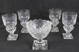 Absinthe: a set of four Pontarlier glasses, circa 1900, with lemon squeezer squared foot,
