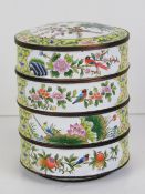 A Chinese Canton enamel on brass dressing table stacking pots opening to reveal three compartments,