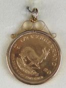 A 22ct gold half Krugerrand, ½ oz fine gold, dated 1980, in a 9ct gold hallmarked pendant mount,