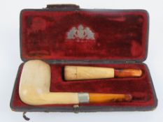 A 19th century meersham pipe having amber mouthpiece with electroplated band,