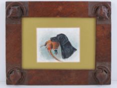 A 19th century oak frame carved with four fox heads and horseshoes,