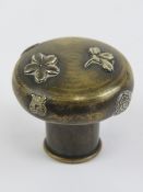 A c1900 Japanese Shakudo stick top / walking cane knop in brass having various applied symbols and