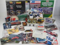 A large quantity of racing themed stickers and ephemera including; pen, clock, beer mats, coin,