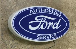 A contemporary illuminated Ford 'Authorised Service' wall sign measuring 59 x 30cm.