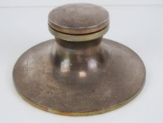 A HM silver capstan inkwell with hinged lid opening to reveal a glass liner,