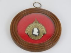A silver gilt oval Pitt Club badge,