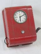 A vintage TR Services wall mounted clocking-in machine bearing circular clock dial with Arabic