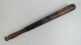 A Victorian truncheon having black ground with painted crown and VR cypher upon with 'LSK' below,