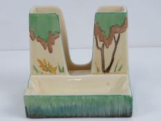A Clarice Cliff cigarette holder with integral ashtray, 9.5cm wide.