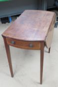 A late Georgian mahogany drop side table of delicate proportions, cross banded throughout,